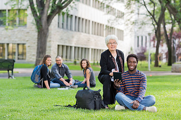 Image showing Professor Helping Student on Digital Tablet