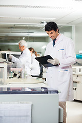 Image showing Researcher Reading Clipboard