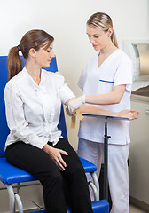 Image showing Nurse Preparing Businesswoman For Blood Test