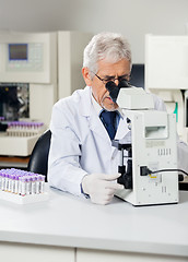 Image showing Male Scientist Using Microscope In Lab