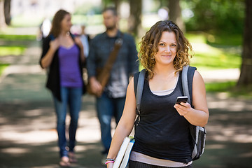 Image showing Female Student Using Cellphone On Campus