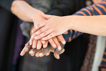 Image showing Multiethnic University Students Stacking Hands