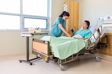 Image showing Nurse Starting IV on Patient