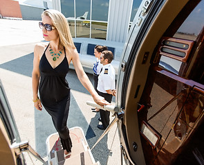 Image showing Beautiful Woman In Dress Boarding Private Jet