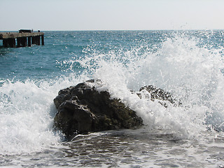 Image showing cold sea waves crashing against the coast stone