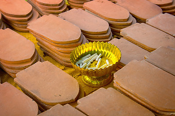 Image showing Clay tiles and chalk. On tiling people write names