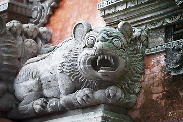 Image showing Animal like a dog on the wall of temple. Bali, Indonesia