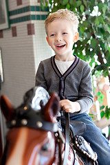 Image showing kid at the horse