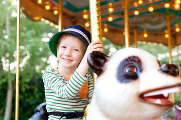 Image showing kid at the merry-go-round