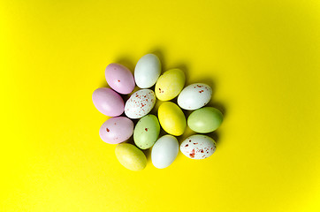 Image showing Easter eggs candy at yellow 