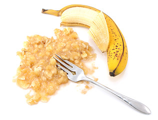 Image showing Half-peeled ripe banana with mashed fruit