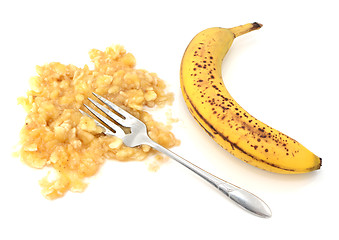 Image showing Spotty ripe banana with mashed flesh and fork