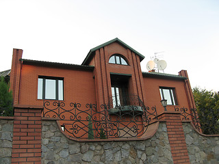 Image showing a recently constructed, contemporary the red-brick house