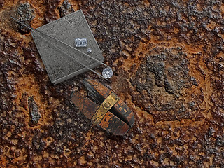 Image showing working rusty plate with diamonds