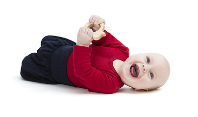 Image showing happy toddler laughing on floor