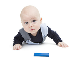 Image showing interested baby with toy block