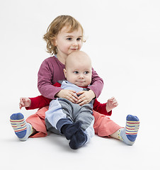 Image showing siblings isolated in light background