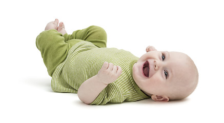 Image showing happy toddler lying on his back