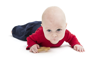 Image showing toddler with toy and red shirt crawling