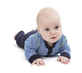 Image showing attentive baby laying on ground