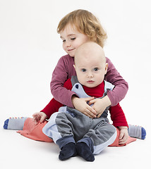 Image showing siblings isolated in light background