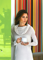 Image showing Relaxed beautiful woman drinking coffee