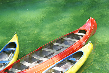 Image showing Three plastic canoe