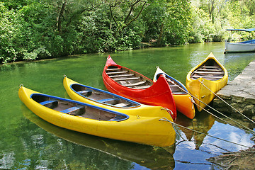 Image showing yellow plastic canoes