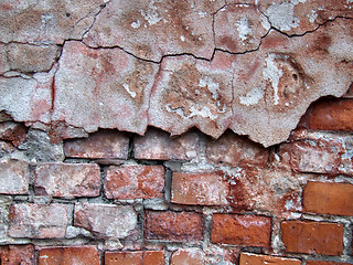 Image showing Red crumbling wall decay