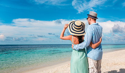 Image showing Vacation Couple walking on tropical beach Maldives.