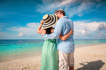 Image showing Vacation Couple walking on tropical beach Maldives.