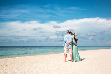 Image showing Vacation Couple walking on tropical beach Maldives.