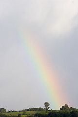 Image showing Rainbow and clouds