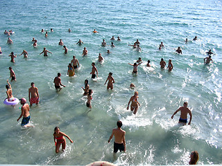 Image showing Young people dance in the afternoon in the sea