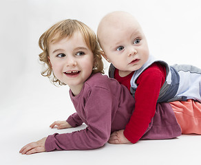 Image showing two children playing on floor