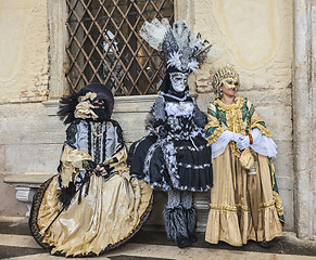 Image showing Three Disguised Persons