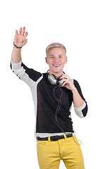 Image showing Man with headphones raising his hand up