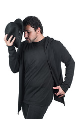 Image showing Man in black dancing with hat