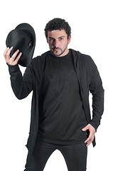 Image showing Man in black with his black hat