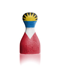 Image showing Wooden pawn with a painting of a flag