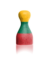 Image showing Wooden pawn with a painting of a flag