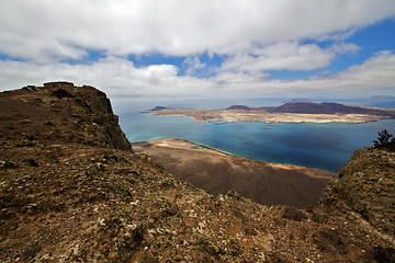 Image showing harbor rock stone sky cloud beach  water  coastline graciosa mir