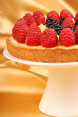 Image showing Custard tart with raspberries and blackberries