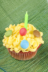 Image showing Cupcake with green candle