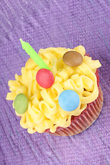 Image showing Birthday cupcake with green candle