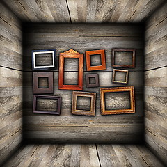 Image showing collection of beautiful frames on wood wall