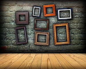 Image showing scratched wall full of wood frames