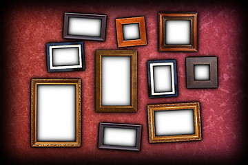 Image showing red scratched wall with frames