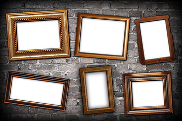 Image showing messy arrangement of frames on wall