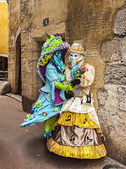 Image showing Two Disguised Persons on a Narrow Street